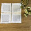 Posavasos blancos calados con bordado blanco