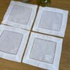 Posavasos blancos calados con bordado blanco